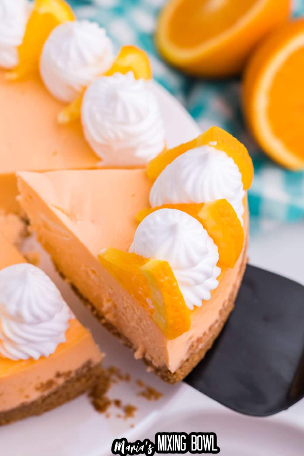 slice of cheesecake being removed from the whole cake