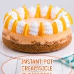 whole uncut cheesecake on a white cake stand