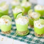 key lime pie shots on a green and white napkin