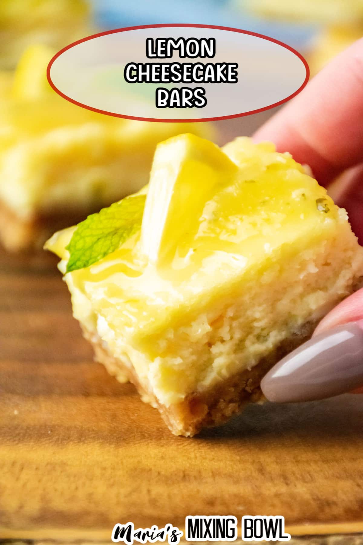 slice of lemon cheesecake bars held in a woman's hand.