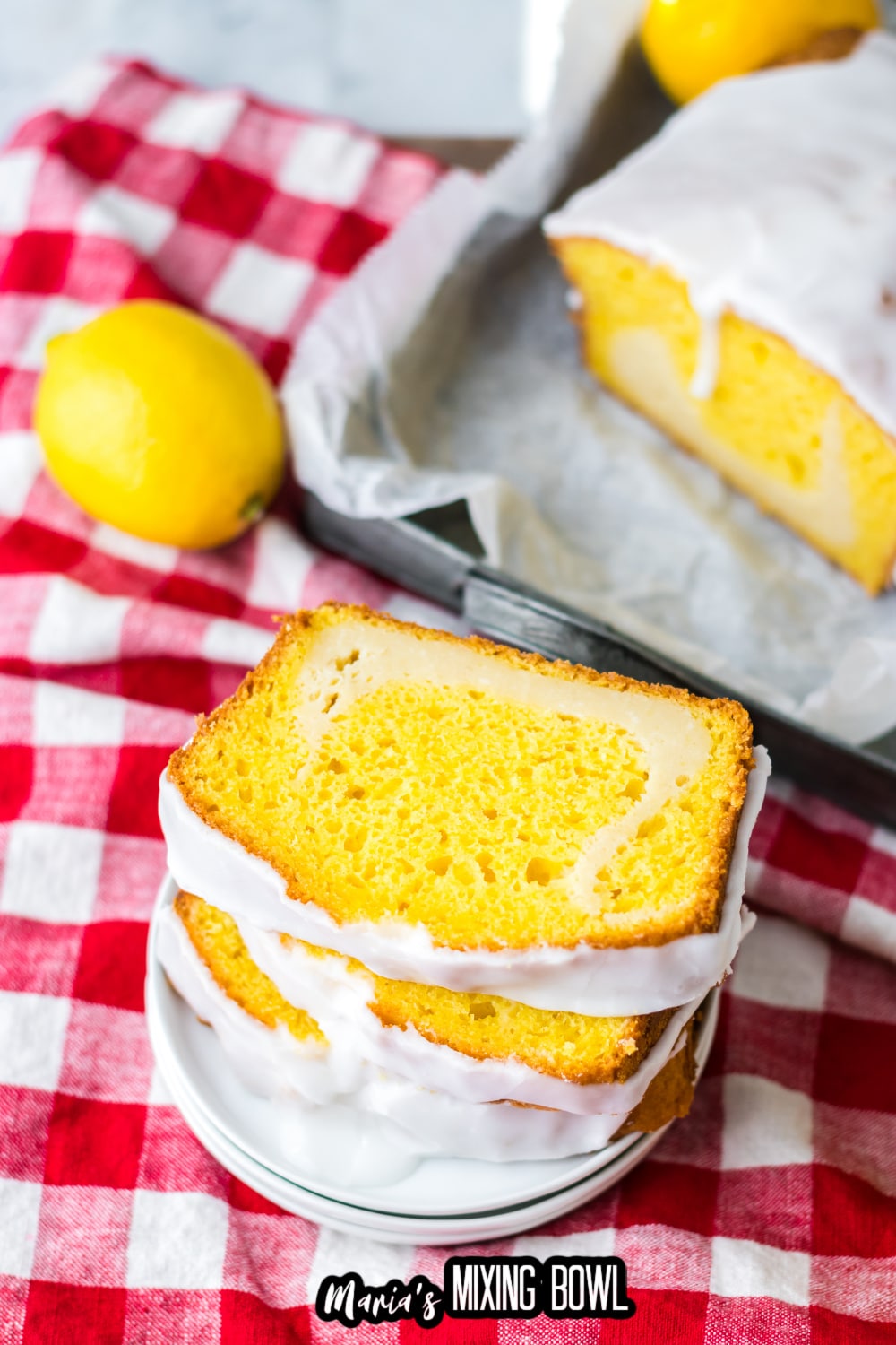three slices of lemon loaf cake on a white plate