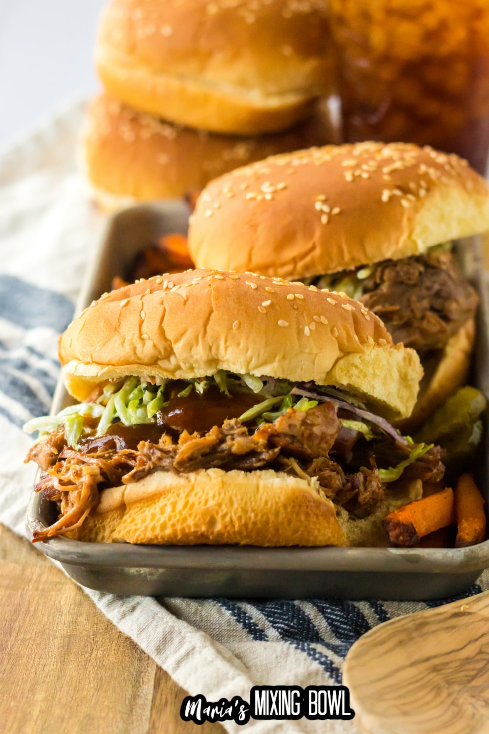 root beer pulled pork sandwiches on a metal serving tray