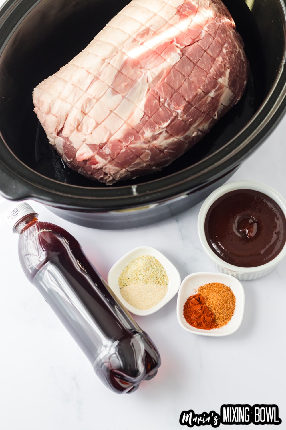 pork roast, soda, bbq sauce, and seasonings on a white background