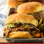 root beer pulled pork sandwiches on a metal serving tray