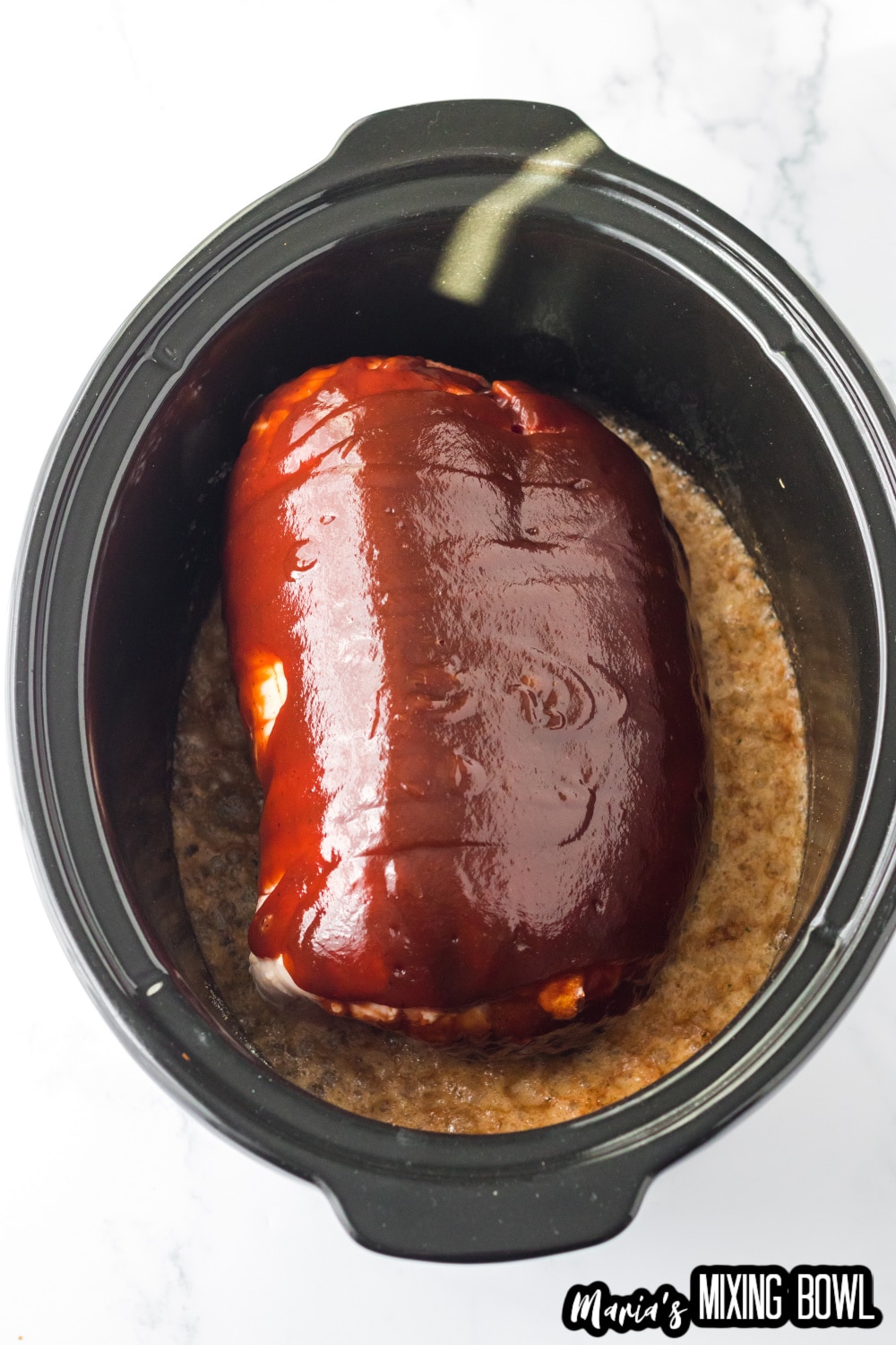 pork roast, seasoning, bbq sauce, and root beer in a slow cooker