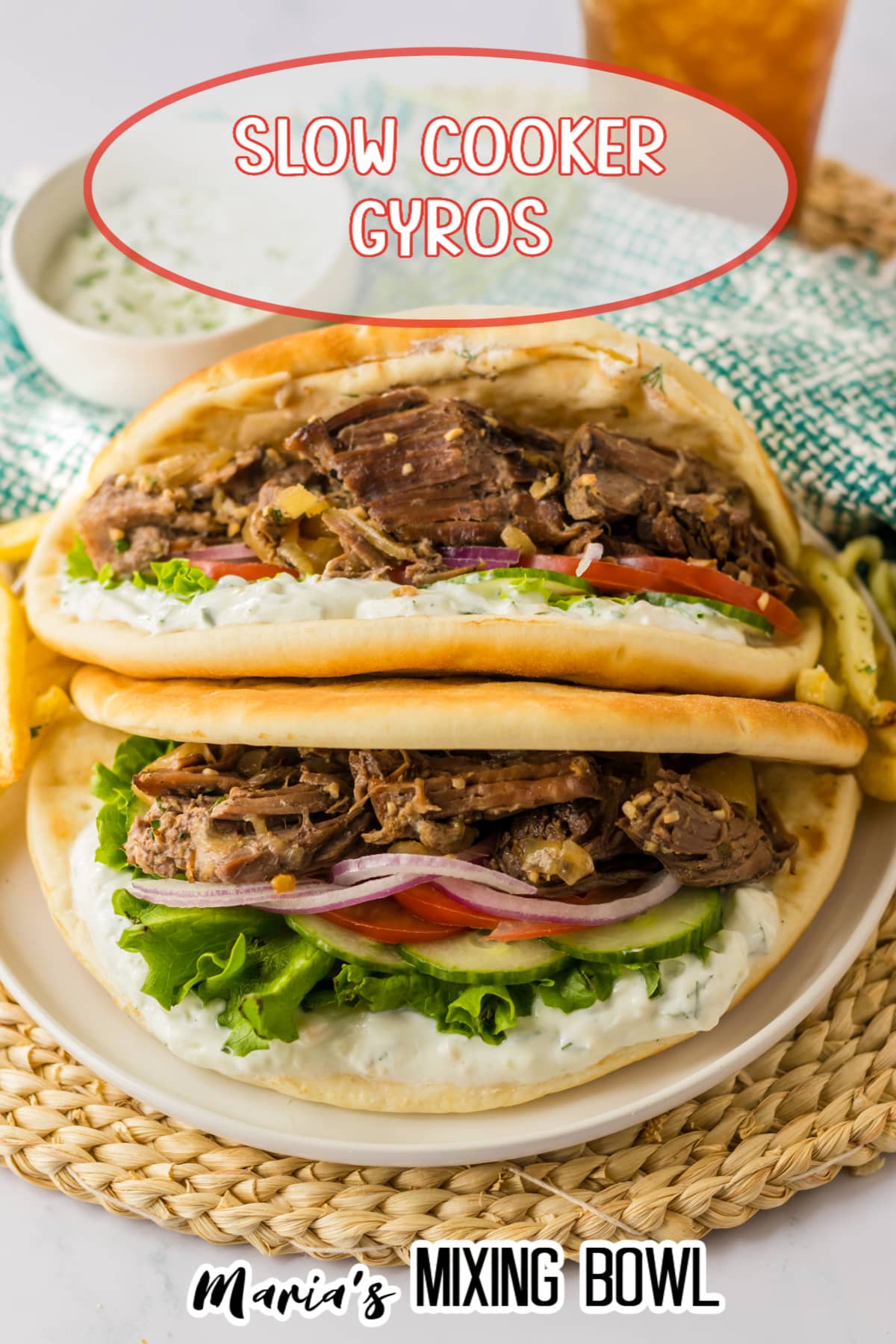 two slow cooker gyros on a white plate
