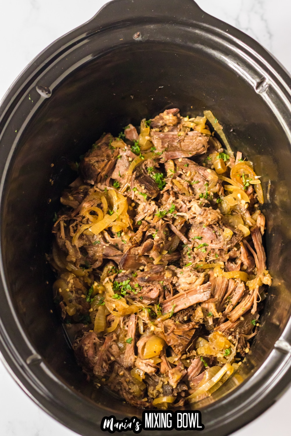 shredded gyro meat in a slow cooker