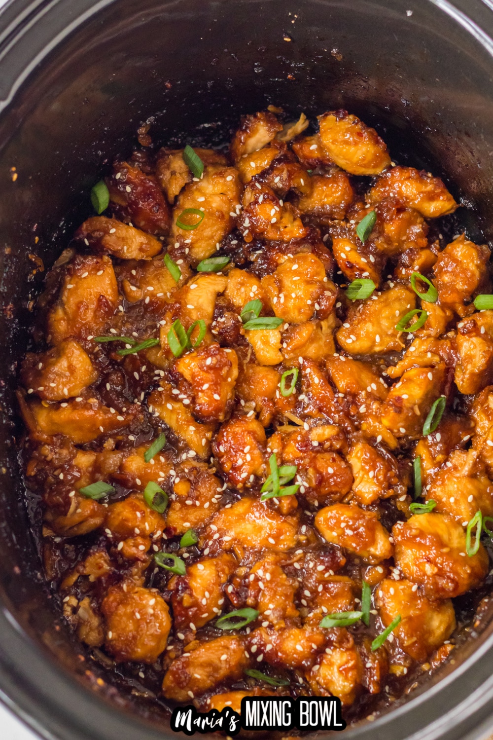 cooked orange chicken in a slow cooker