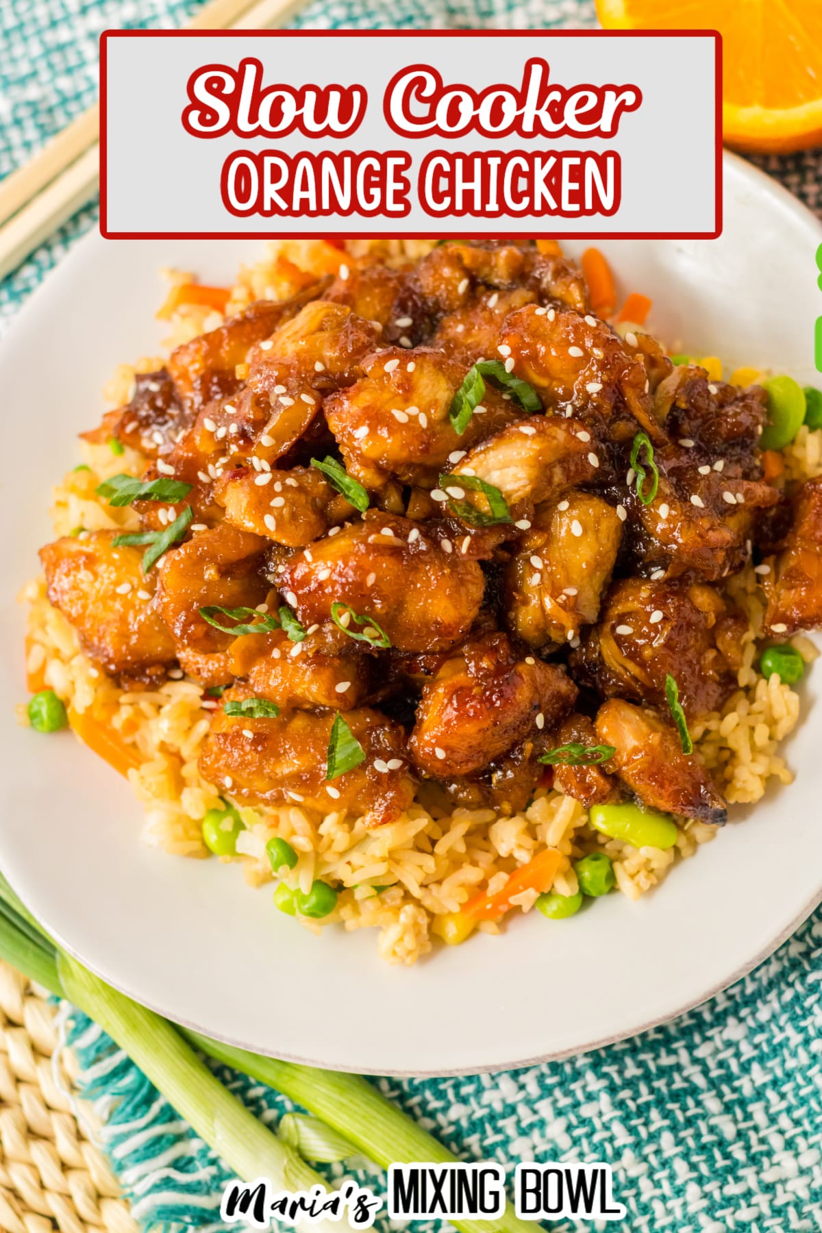 plate of slow cooker orange chicken on a bed of rice