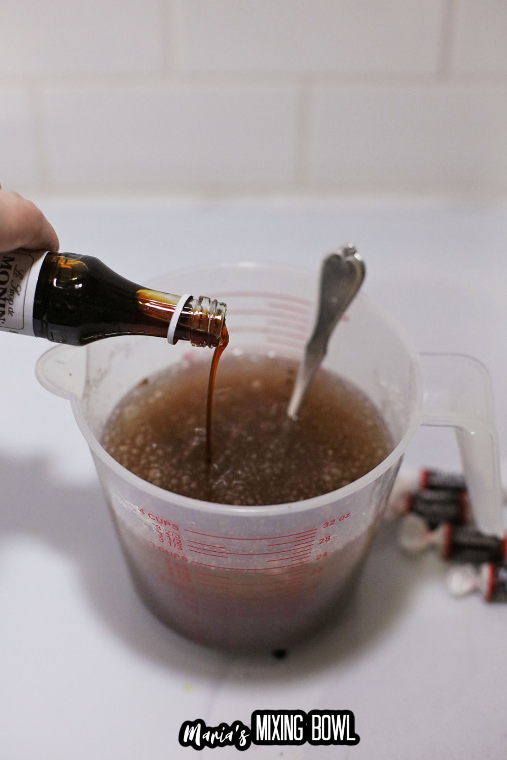 syrup being added to gelatin and water
