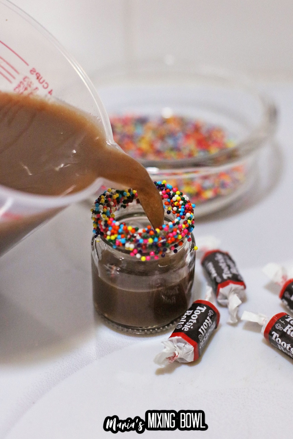 shot being pour into a shot glass
