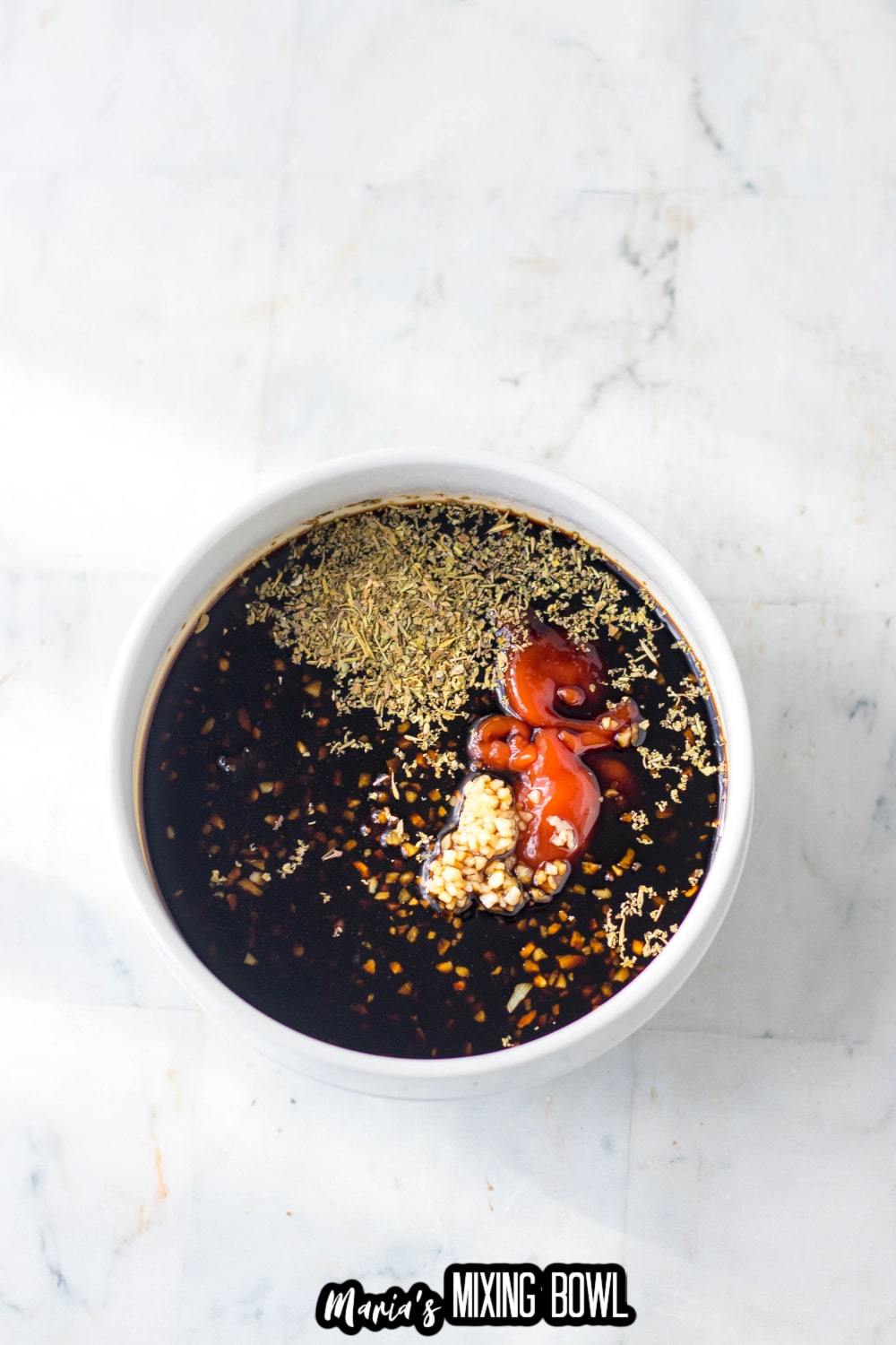 soy sauce, ketchup, and garlic and other sauce ingredients in small mixing bowl