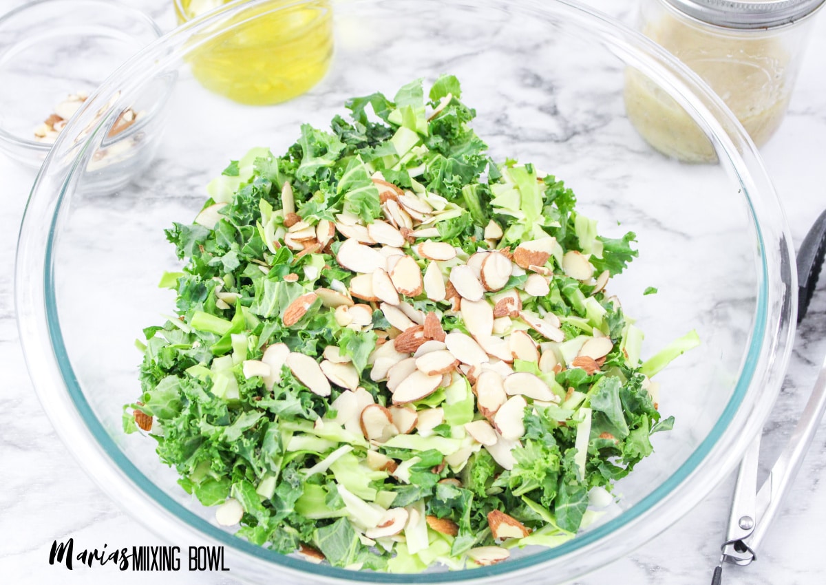 undressed salad in a glass mixing bowl