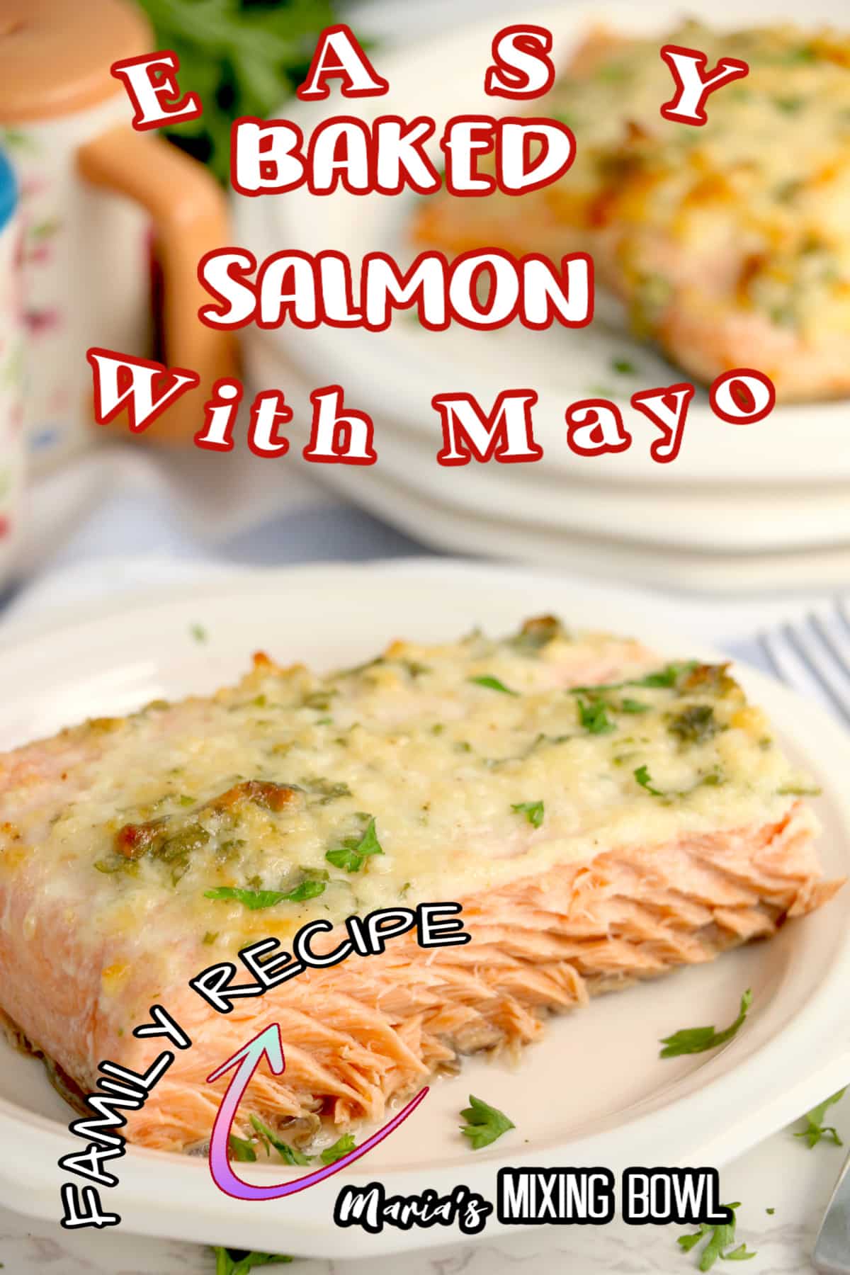 birds eye image of a baked salmon filet on a white plate that is garnished with fresh parsley