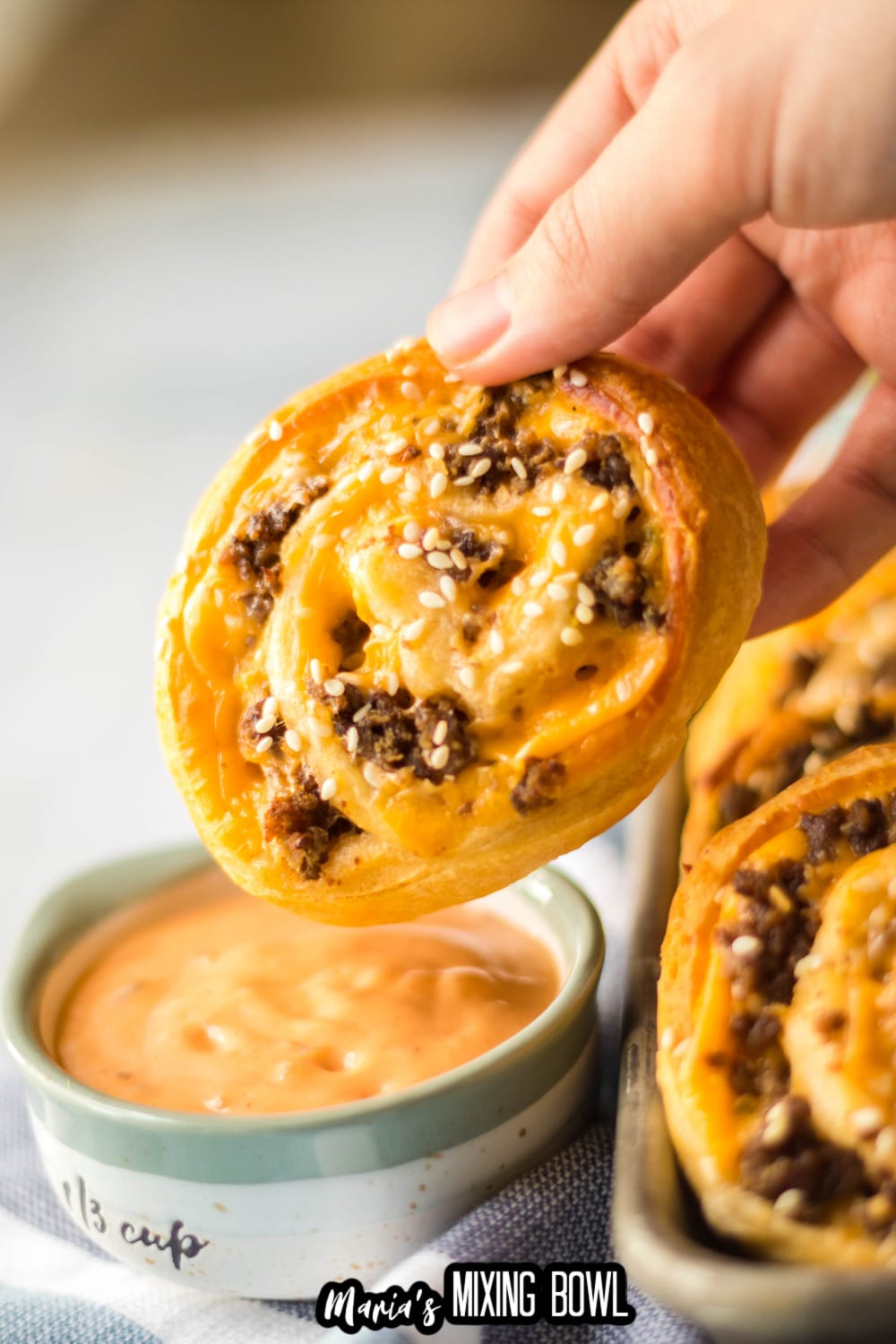 big mac pinwheel being dipped in big mac sauce