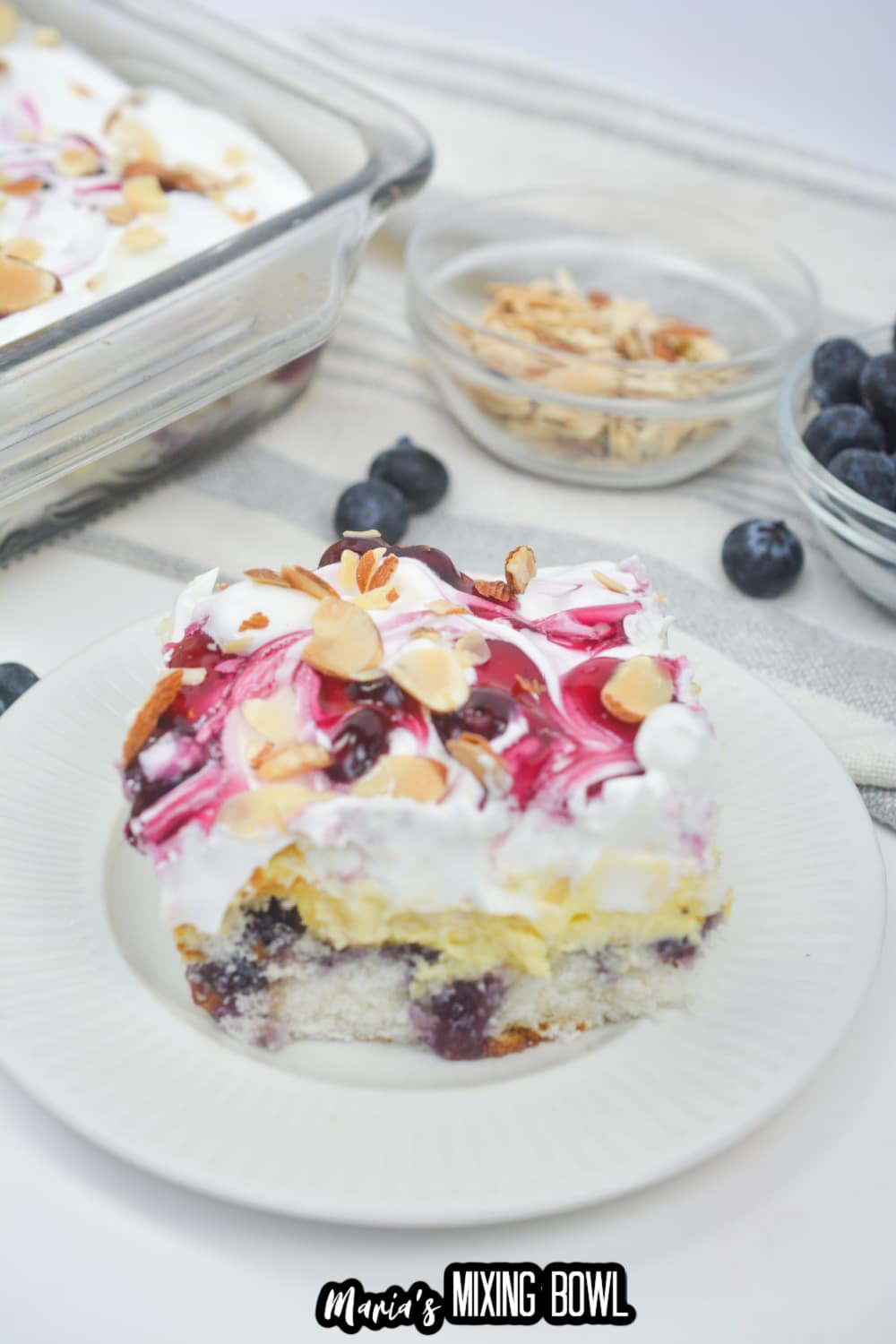 slice of blueberry heaven on earth cake on a white plate