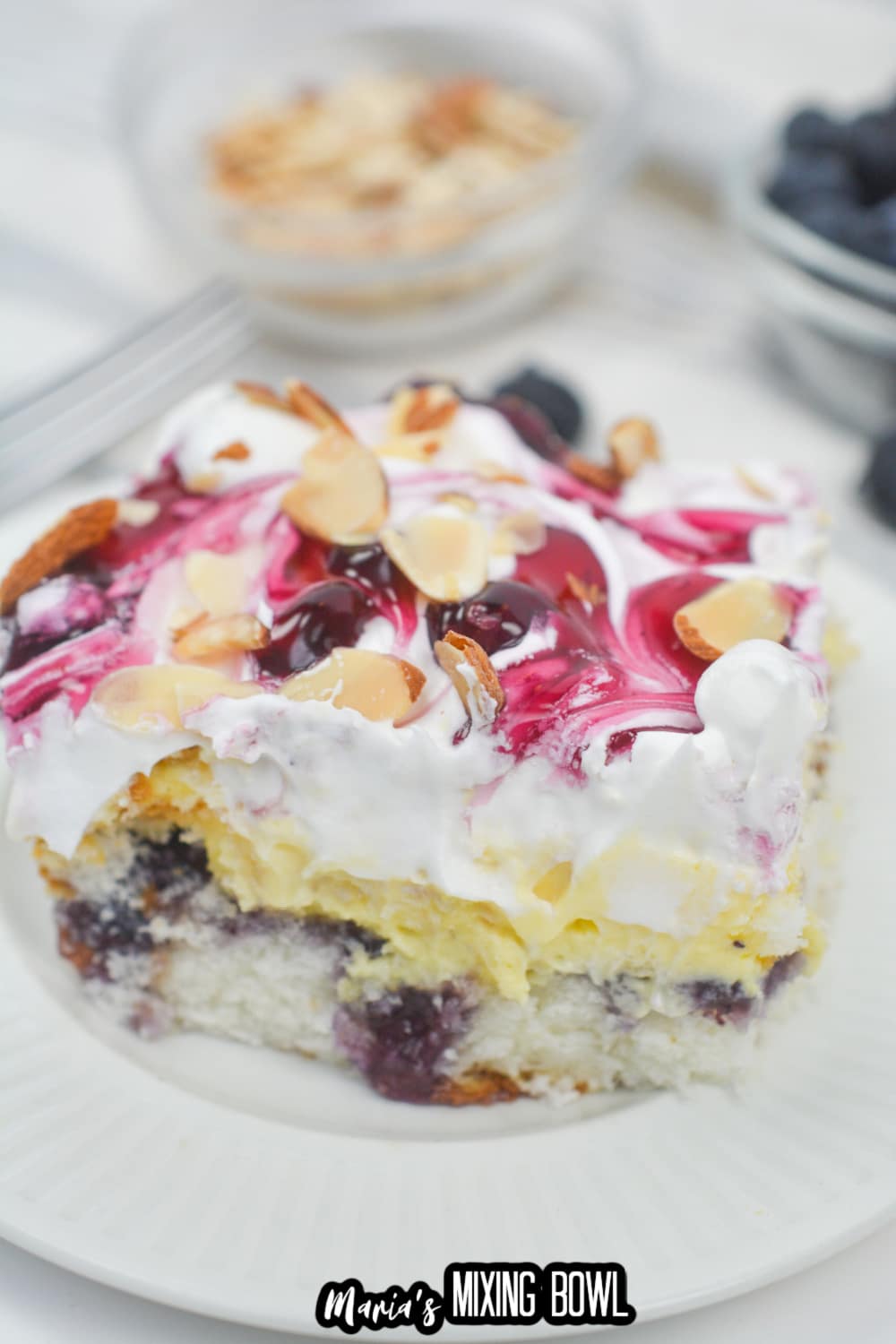 slice of blueberry heaven on earth cake on a white plate