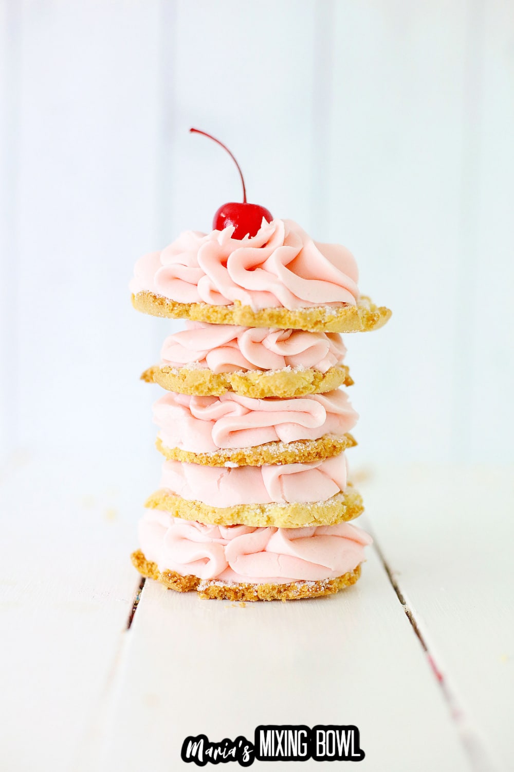 five cherry cookies stacked on top of each other