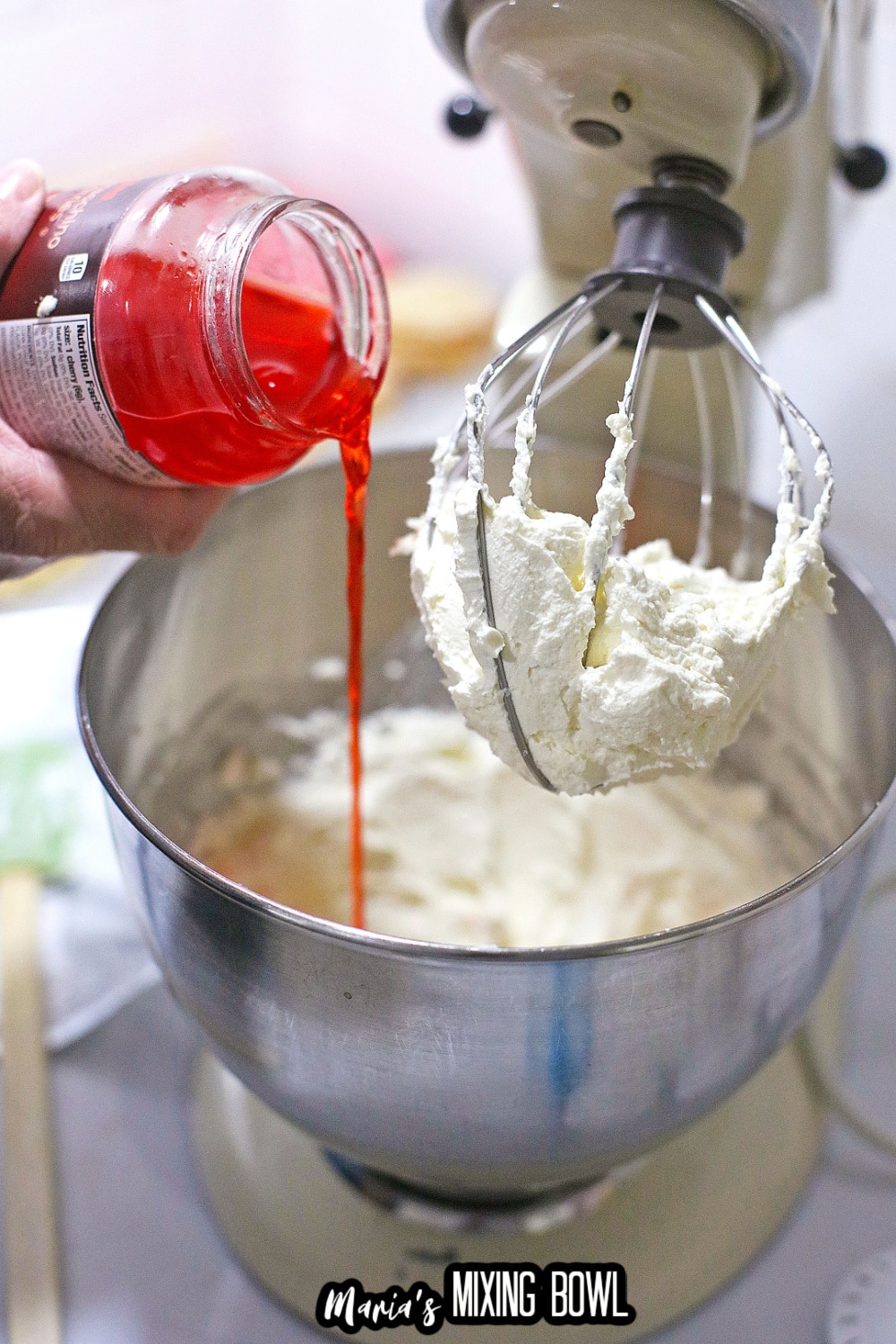 cherry juice being added to cream cheese