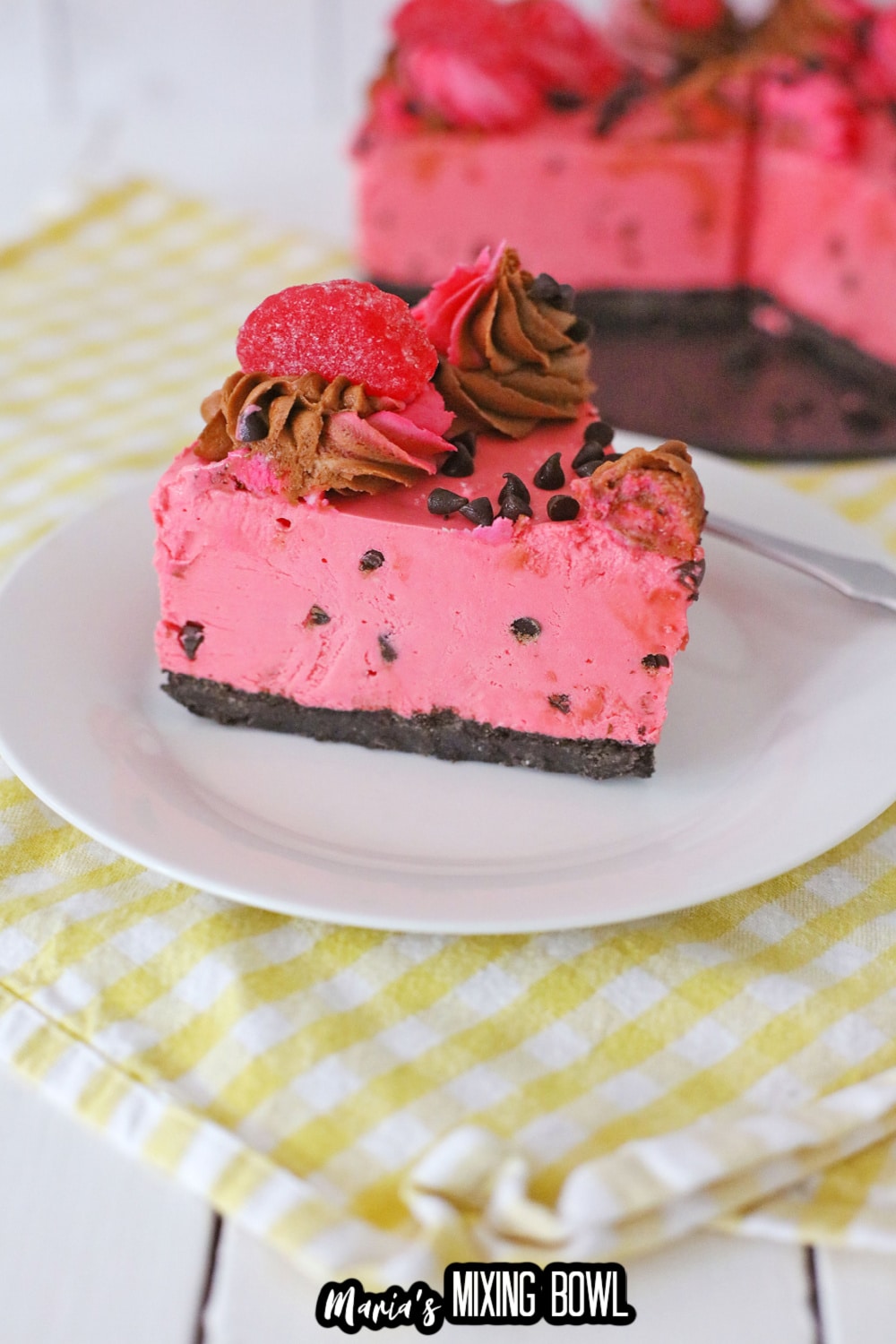 slice of cherry chip cheesecake on a white plate