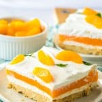 slice of creamsicle lush on an off white plate