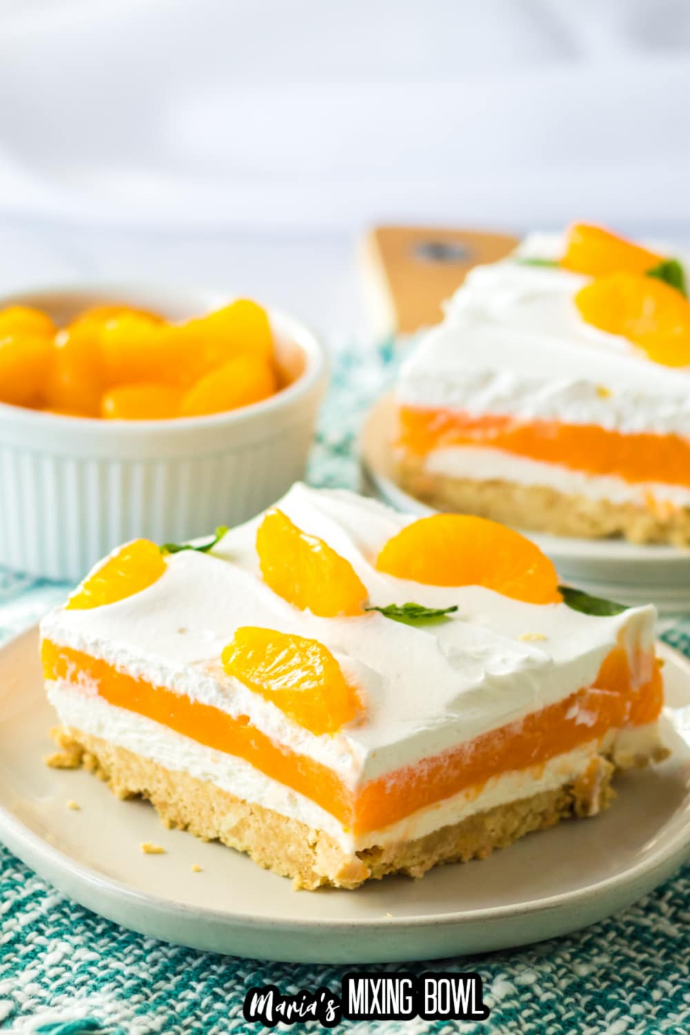 slice of creamsicle lush on an off white plate