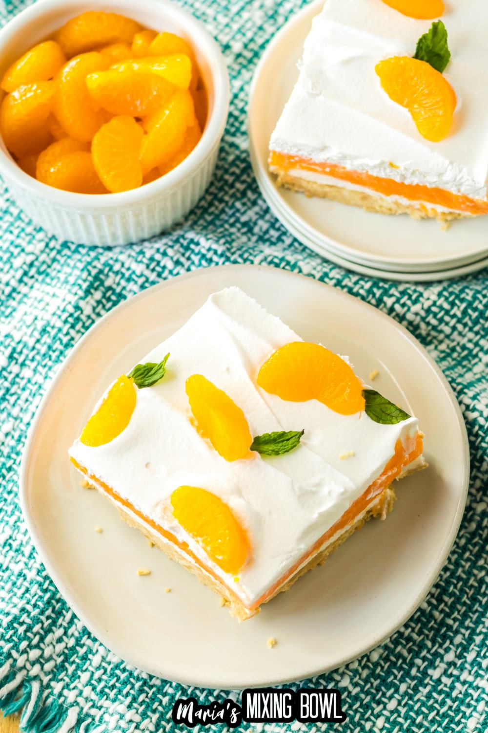 slice of creamsicle lush on an off white plate