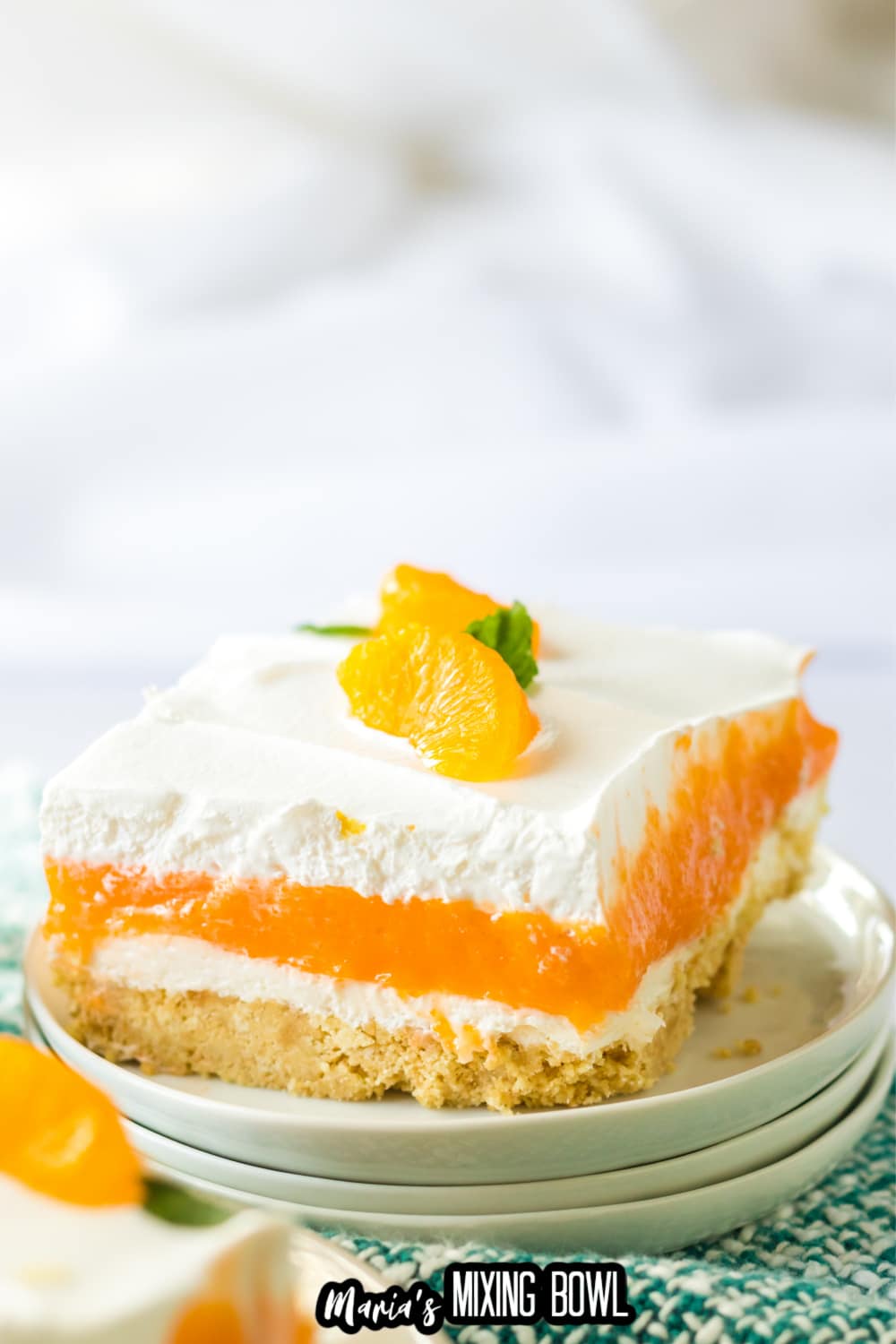 slice of creamsicle lush on an off white plate