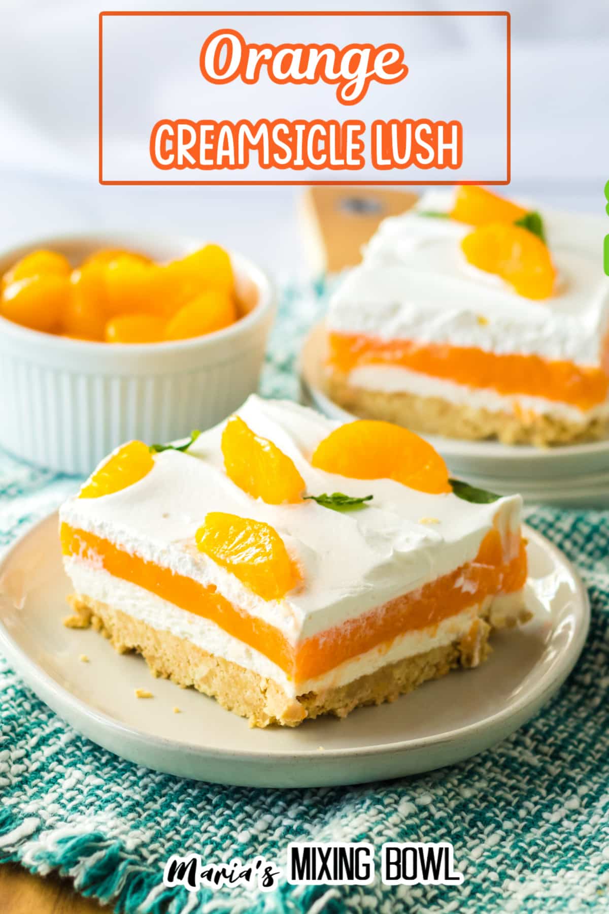 slice of creamsicle lush on an off white plate