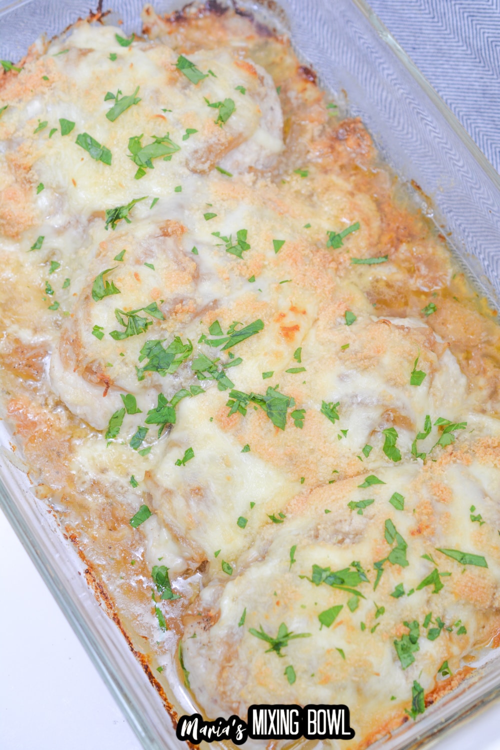 baked french onion chicken in a glass casserole dish