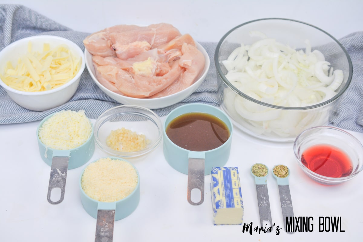 chicken. cheese, onions, butter, garlic and seasonings on a white background