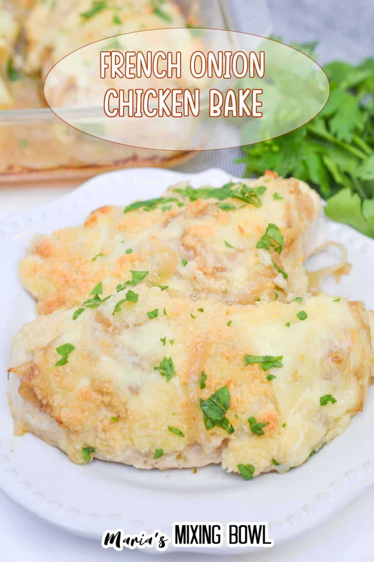 two pieces of french onion chicken on a white plate