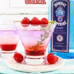 gin berry cocktail in a cocktail glass garnished with raspberries on a toothpick