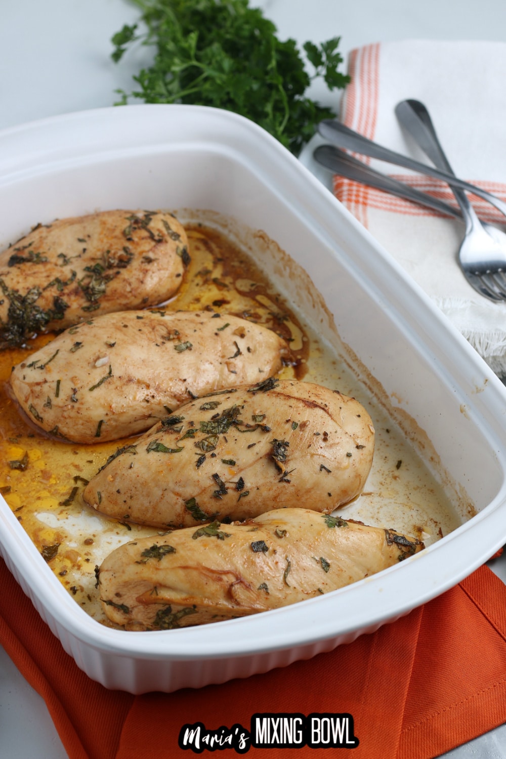 baked chicken breasts in a ceramic baking dish