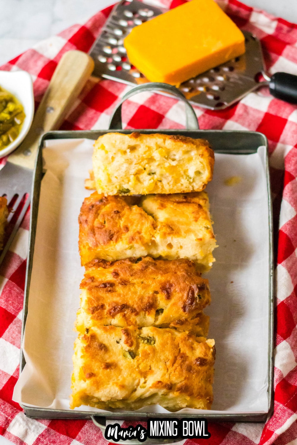 jalapeno cheddar biscuits on a metal serving tray