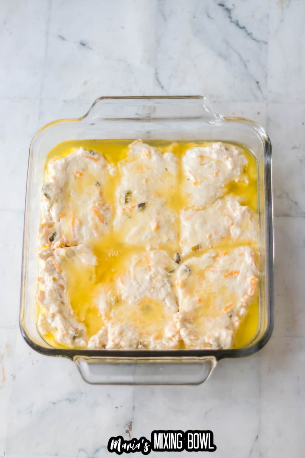 biscuit dough in a glass baking dish