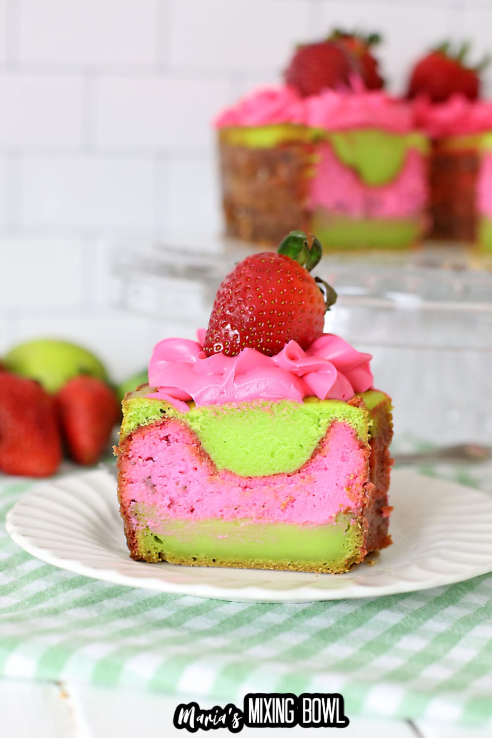 slice of key lime strawberry cake on a white plate