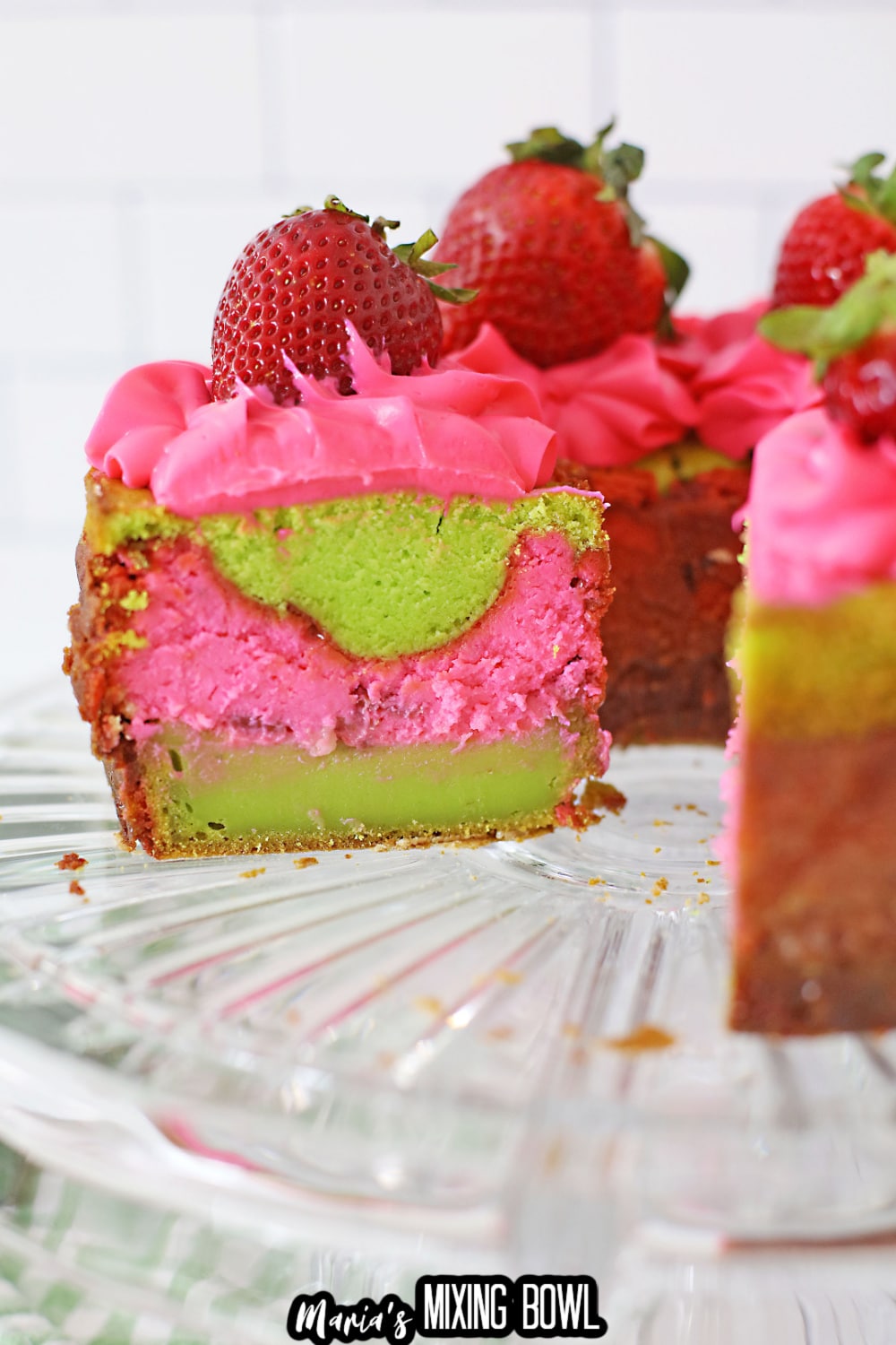 slice of key lime strawberry cake on a white plate