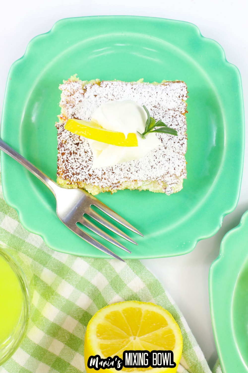 slice of lemon cake mix bars on a green plate