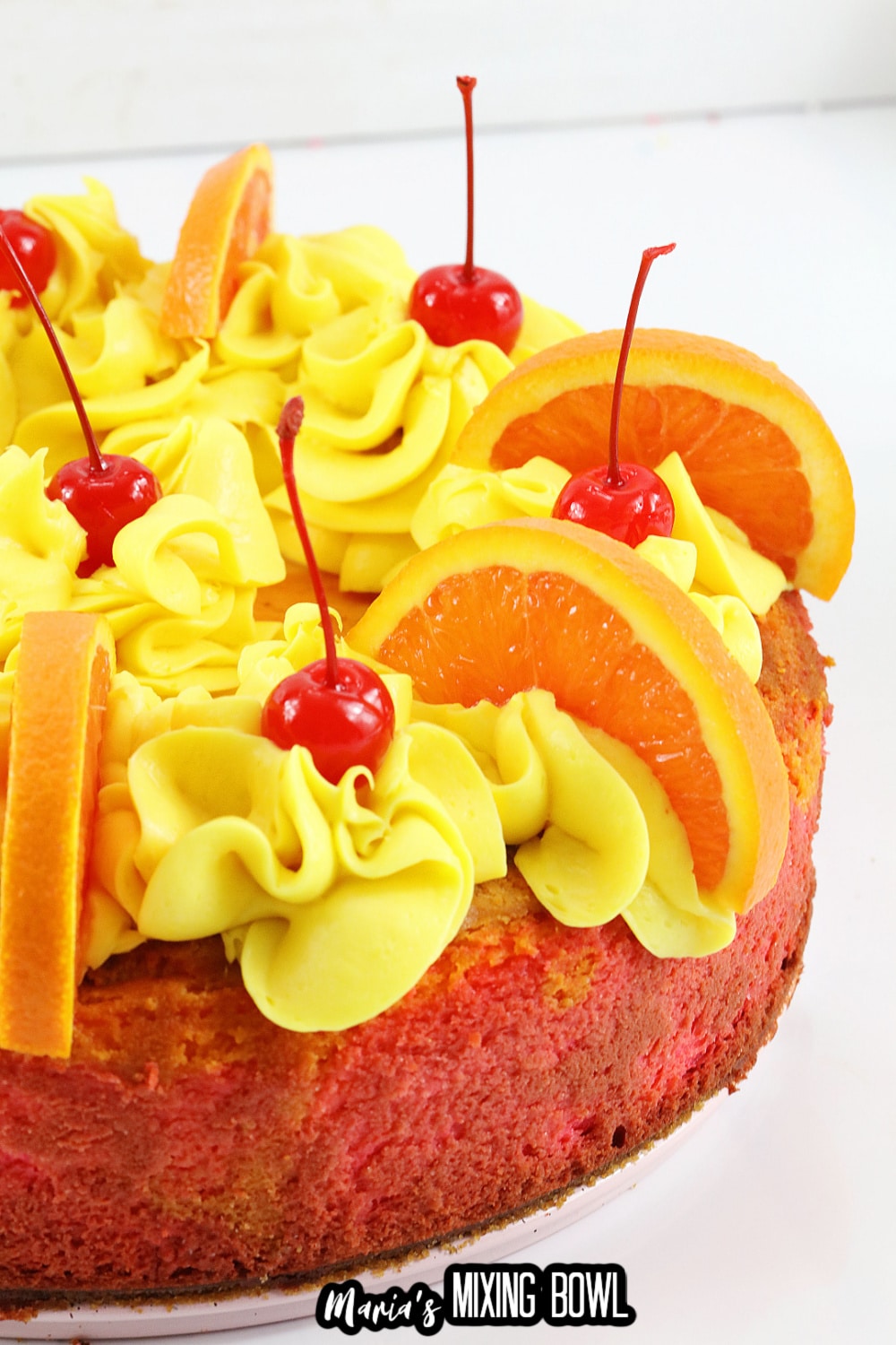 off center image of a whole malibu rum cheesecake on a white background
