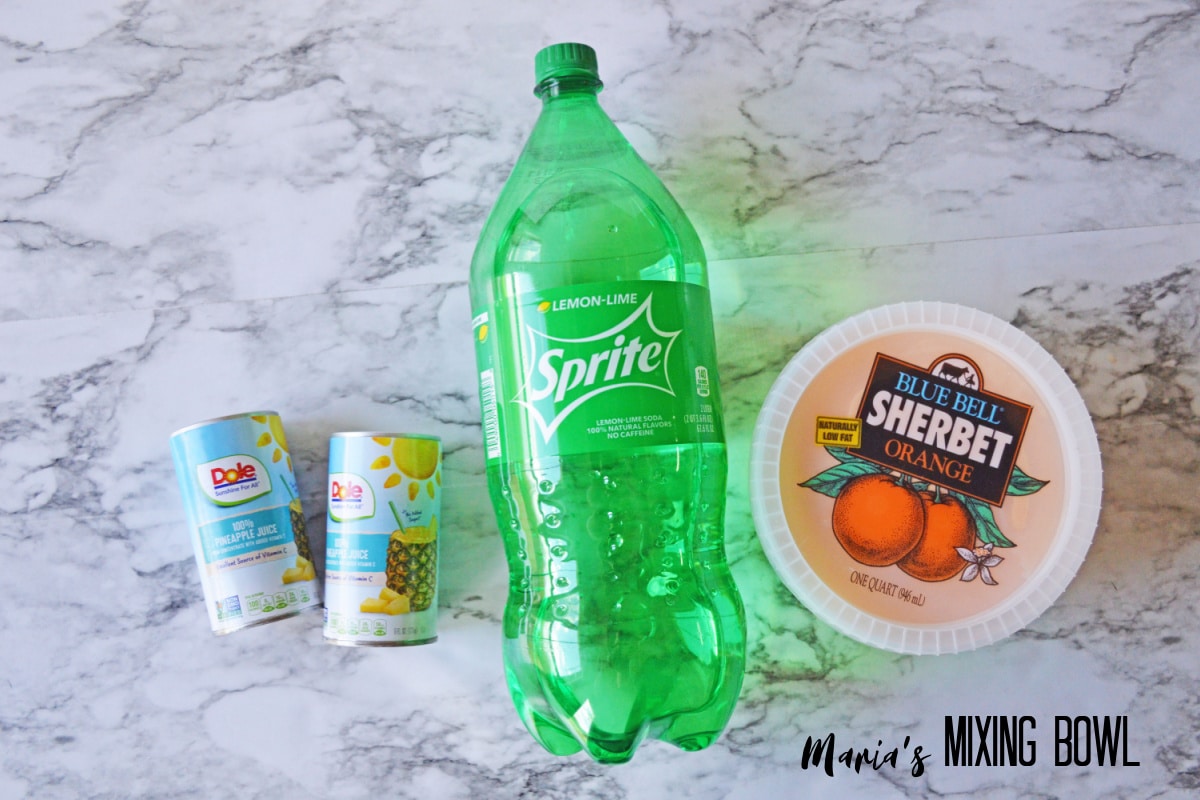 sprite, pineapple juice, and orange sherbet on a marble background
