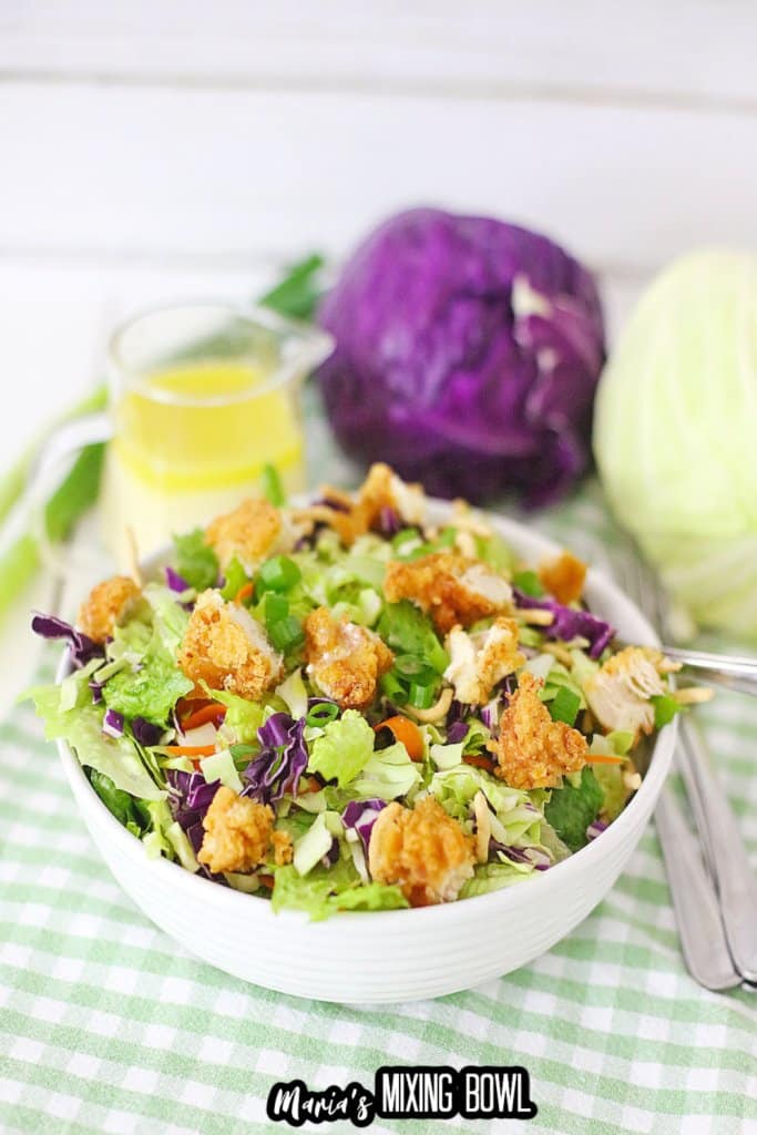 close up of a white bowl filled with applebees oriental chicken salad