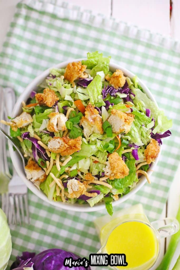 close up of a white bowl filled with applebees oriental chicken salad