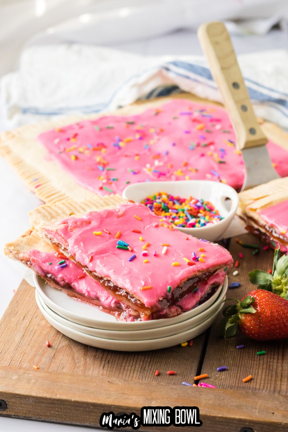 slices of sheet pan pop tart on three white plates