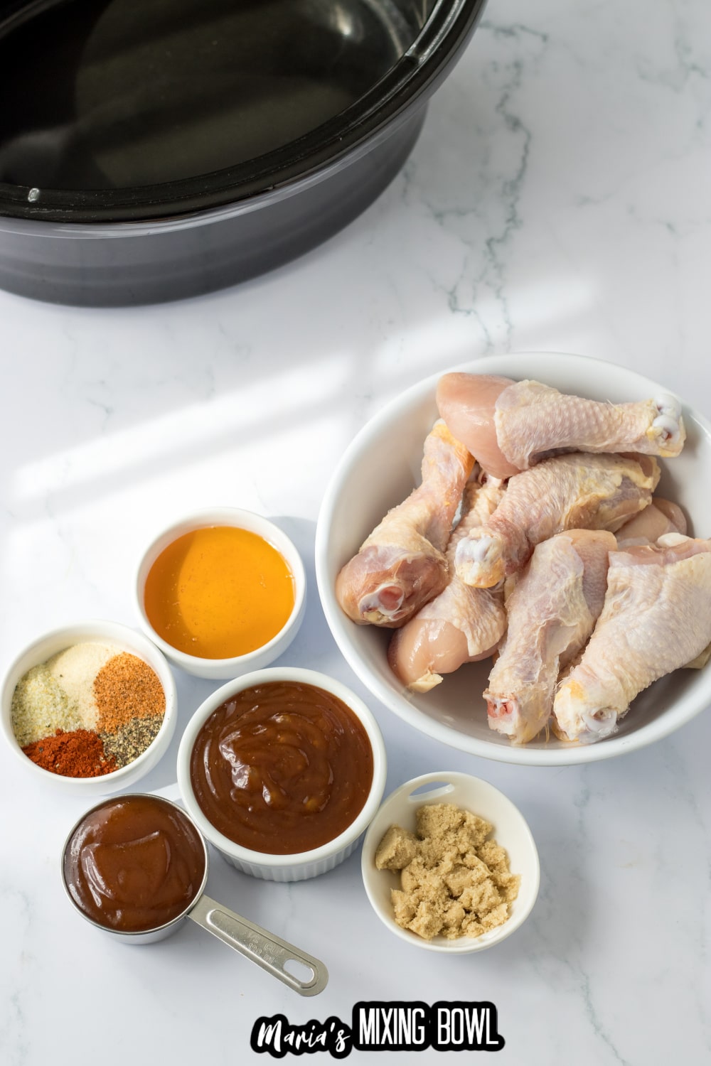 bowls of chicken legs, seasoning, honey, bbq sauce, and brown sugar
