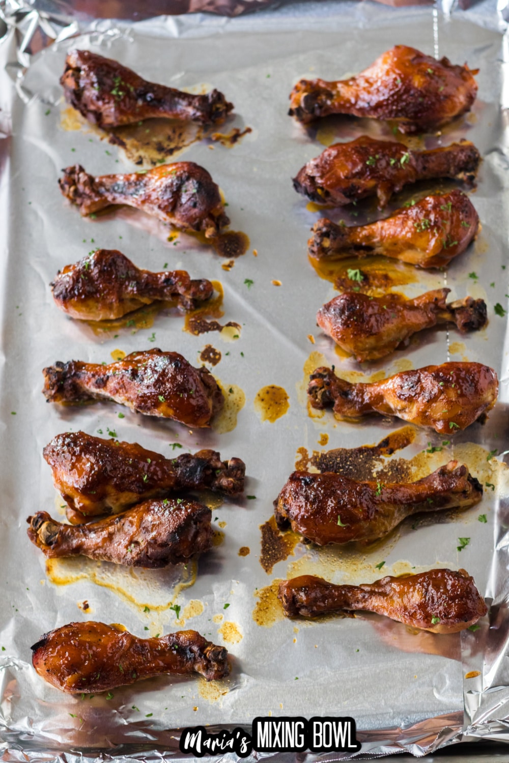 chicken drumsticks on a foil-lined baking sheet