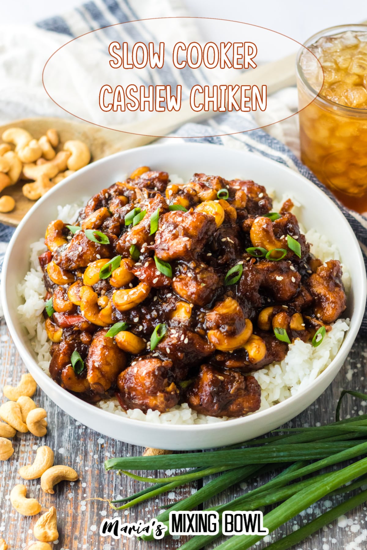 a white bowl filled with slow cooker cashew chicken and white rice
