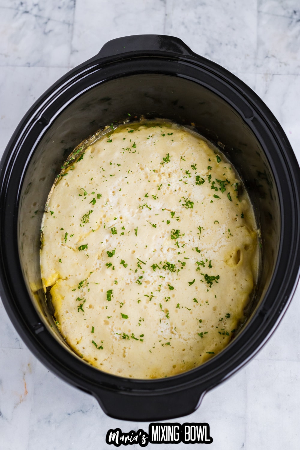 cooked slow cooker chicken pot pie in a slow cooker liner