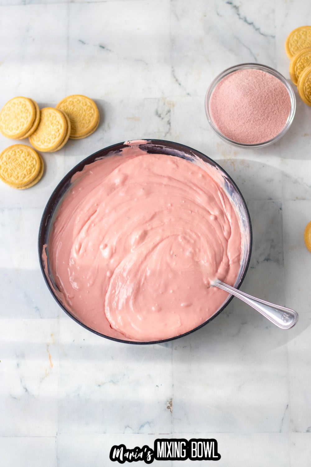 strawberry flavored candy melts, melted in a dark bowl
