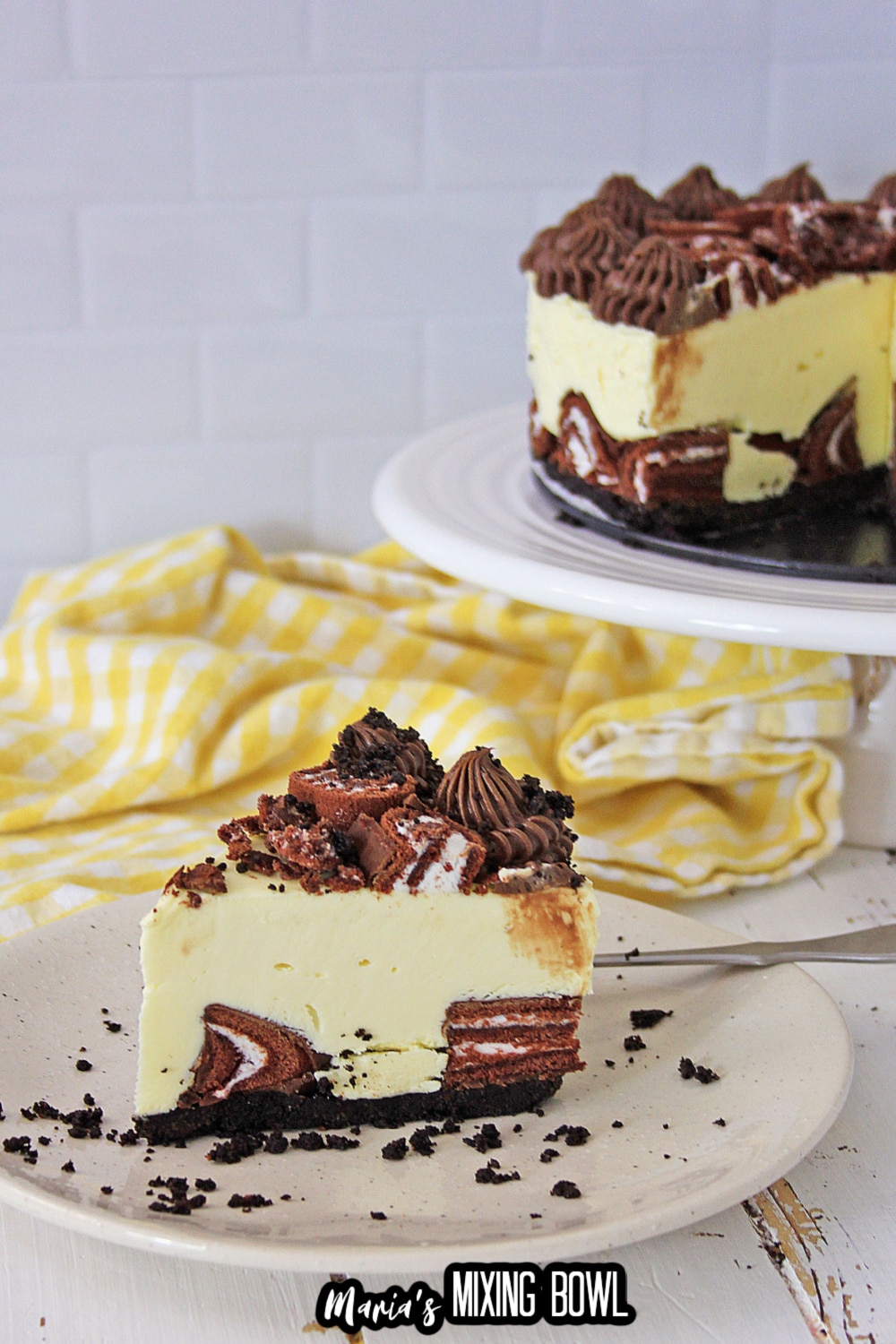 slice of swiss roll cake cheesecake on a white plate